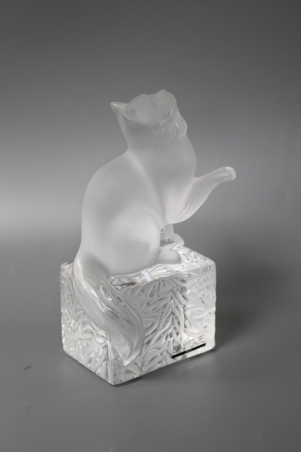 A modern Lalique frosted glass paperweight modelled as a seated cat, height 14.5cm, in original cardboard box,